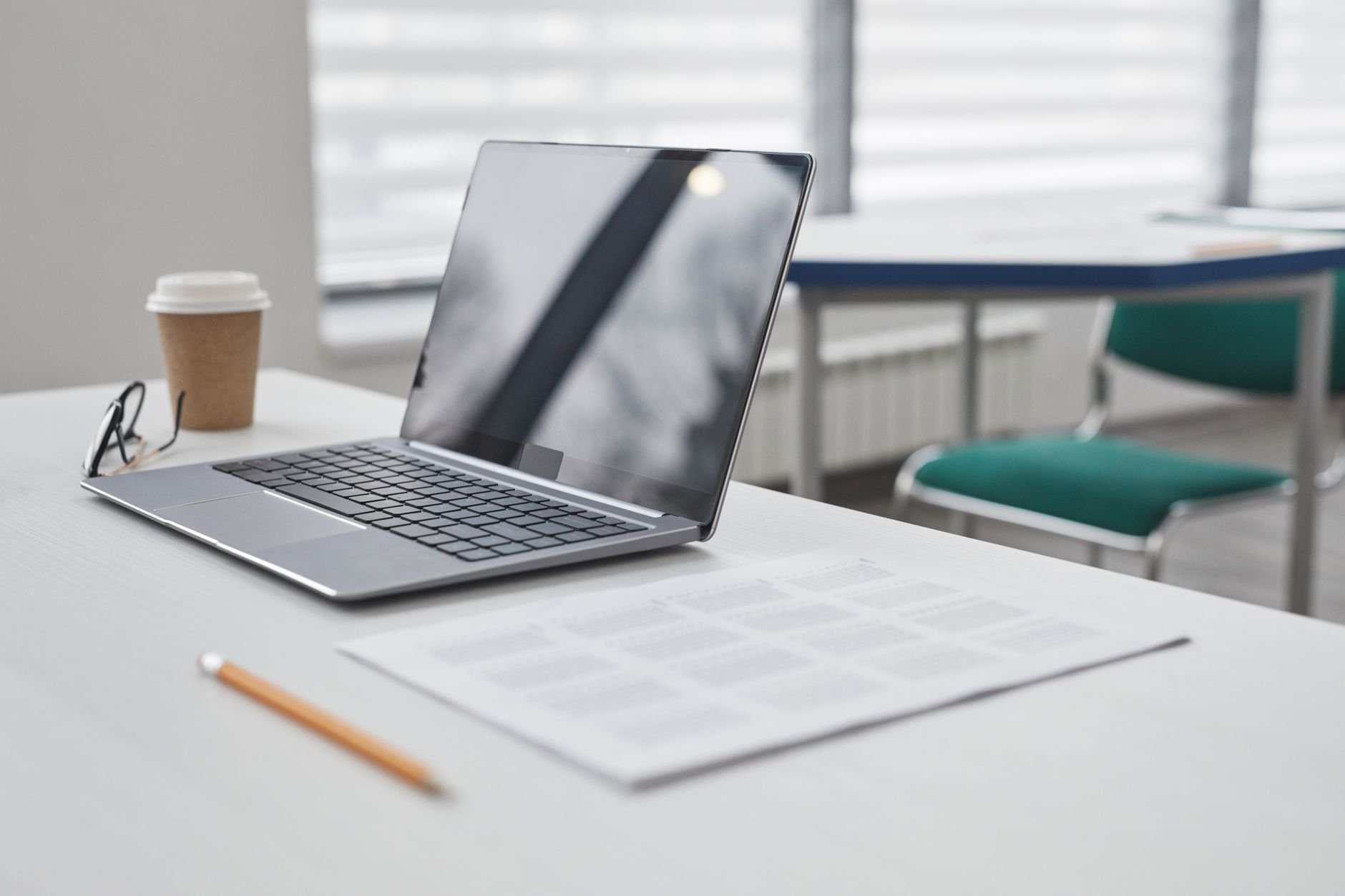 Laptop and notes on a desk